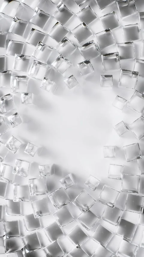 Transparent glass cubes spin in a circular motion on a clean white surface Stock Footage 344148421