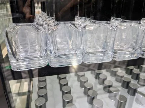 Transparent glass empty bottles in a row, used for perfume refills Stock Photos