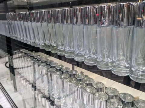 Transparent glass empty bottles in a row, used for perfume refills Stock Photos