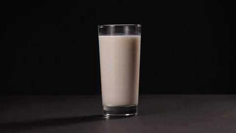 Transparent glass with milk, static plan Stock Footage 75223032