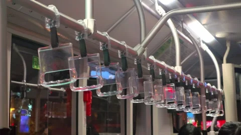 Transparent handle on the bus, the interior of a running bus Stock Footage 322780537