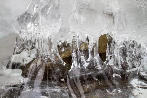 Transparent ice covers the stone Stock Photos