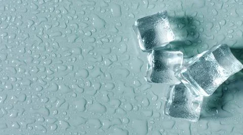 Transparent ice cubes on the light background of the mine space. 스톡 사진