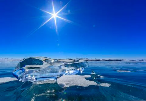 Transparent ice lying on the ice Stock Photos
