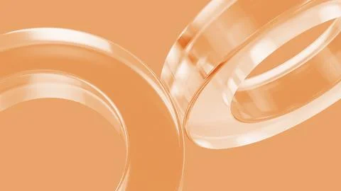 Transparent interlocking rings creating dynamic visual interest on orange Stock Photos