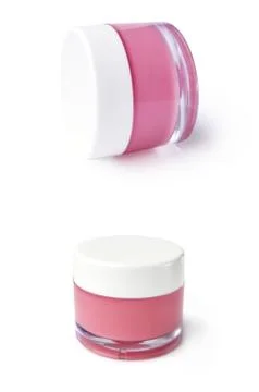 Transparent jar with white cap and pink content Foto stock
