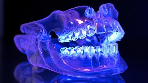 Transparent Jaw with Glowing Teeth Under Blue Light Stock Illustration