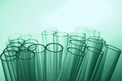 Transparent laboratory test tubes form abstract medical background with soft Foto stock