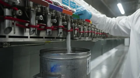 A transparent liquid is bottled on a large scale to create a new perfume Stock Footage 237744193