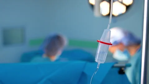Transparent liquid dripping inside the drop counter reservoir.  Stock Footage 302483446