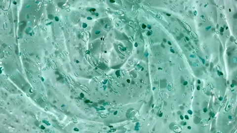 Transparent liquid gel background, clear serum texture. Motion, rotation of the Stock Footage 237020196