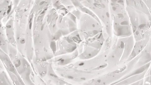 Transparent liquid gel background, clear serum texture. Motion, rotation of the Stock Footage 245842208