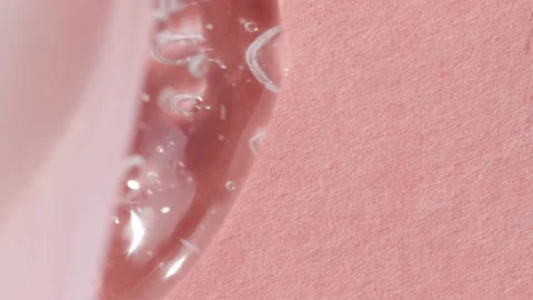 Transparent liquid gel texture close-up, dab of soap, hyaluron flat lay Video stock 233591680