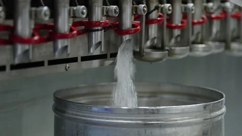 A transparent liquid is poured into a container to create perfume Stock Footage 237744496