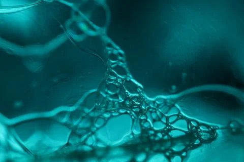 Transparent liquid surface, bubbles of thick liquid Stock Photos