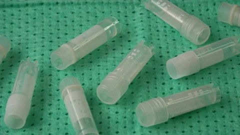 Transparent little test tubes lying on the table. Sterile medicine equipment. Stock Footage 168239610