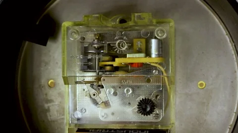 Transparent mechanical clockwork mechanism with gears and internal components Stockbeeldmateriaal 335541232
