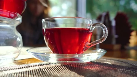 Transparent mug of tea standing on the table Stockbeeldmateriaal 139131158