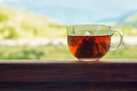 Transparent mug with triangular tea bag Stock Photos