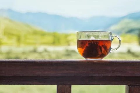 Transparent mug with triangular tea bag Stock Photos