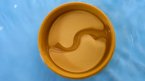 Transparent patches under in round jar top view, concept of moisturizing and Stock Footage 218053753