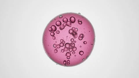 Transparent pink 3D liquid droplet with suspended inner drops Stock Footage 335958692