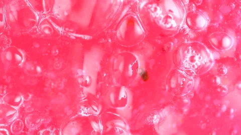 Transparent pink liquid gel background, cosmetics product with bubbles text.. Stock Footage 255599100