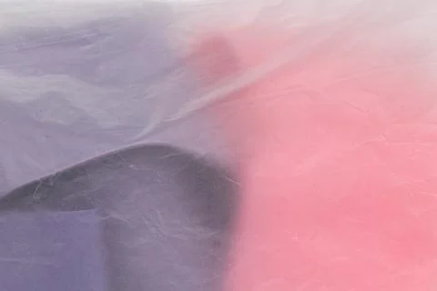 A transparent plastic bag with things close-up as a background or wallpaper Stock-Fotos