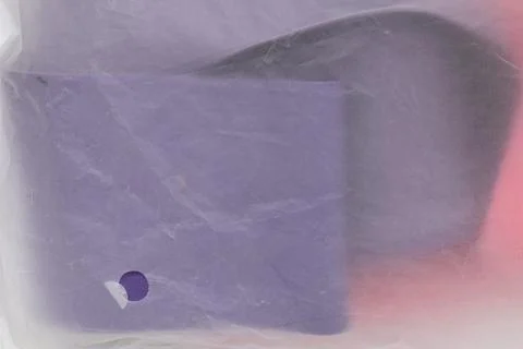 A transparent plastic bag with things close-up as a background or wallpaper Stock Photos
