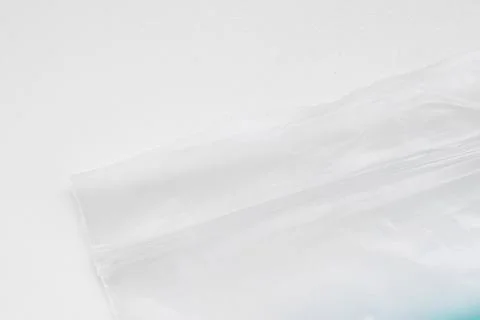 Transparent plastic bag with a zip lock on a white background Stock Photos