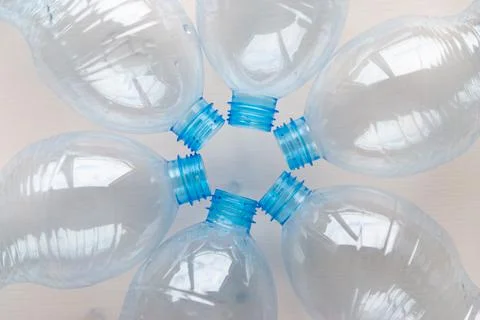 Transparent plastic bottles, on a clear surface. Stock Photos