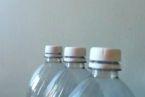 Transparent plastic bottles on a light background 库存照片