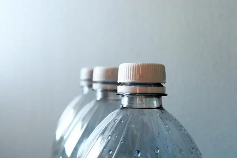 Transparent plastic bottles on a light background Fotos de archivo