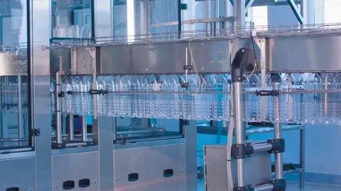Transparent plastic bottles move on conveyor belt Stock Footage 131843209
