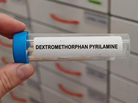 Transparent plastic box of DEXTROMETHORPHAN PYRILAMINE antitussive for dry .. Stock Photos