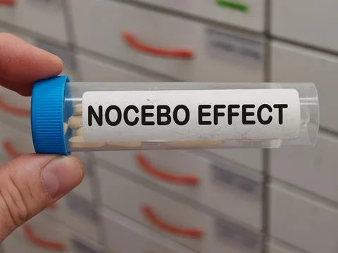 Transparent plastic box of NOCEBO EFFECT placebo and nocebo research topic for Stock Photos