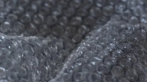Transparent plastic bubble wrap for package, abstract background, close up Stock Footage 243902707