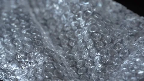 Transparent plastic bubble wrap for package, abstract background, close up Video stock 243902899