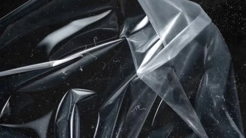 Transparent Plastic Fold Texture with Soft Highlights on Dark Background Video stock 327968930