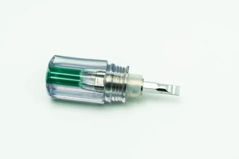 Transparent plastic slotted mini screwdriver. Isolated on white background Stock Photos
