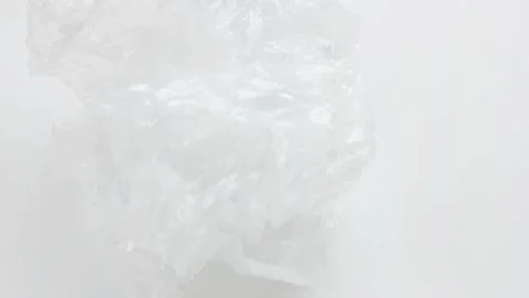 Transparent plastic on a white background, plastic packaging, Stock Footage 255471114