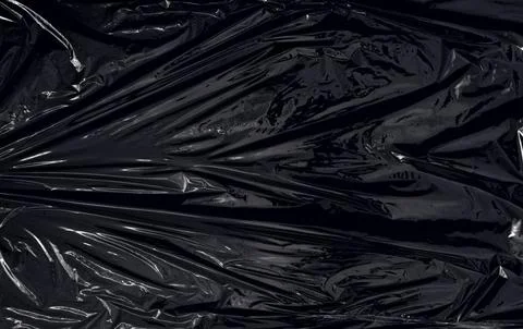 A transparent plastic wrap on black background Stock Photos