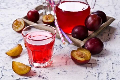 Transparent plum drink Stock Photos