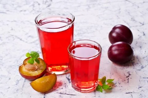 Transparent plum drink Stock Photos