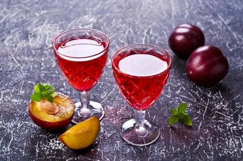 Transparent plum drink Stock Photos