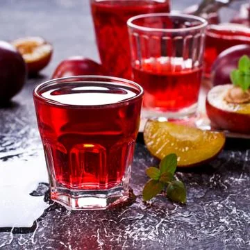 Transparent plum drink Stock Photos
