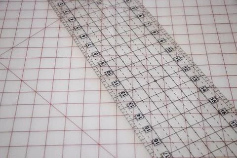 Transparent Ruler on Gridded Cutting Mat for Precision Measuring Stock Photos