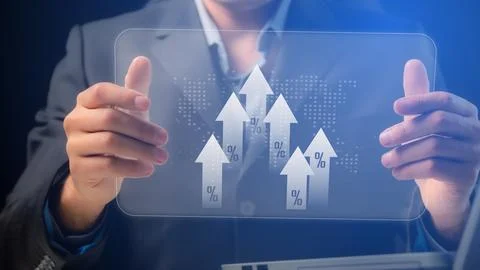 On the transparent screen of the electronic tablet, the arrows move upwards w Stock Photos