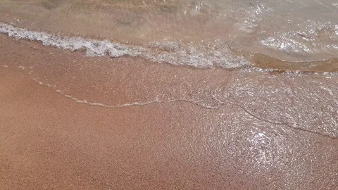 Transparent sea waves on the beach Stock Footage 129888312