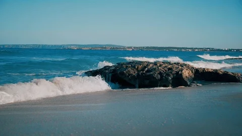 Transparent sea waves break on the rocks Stock Footage 125208841